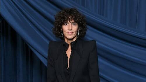 Francesca Bellettini photographed against a draped backdrop at a public event