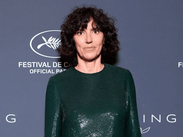 Francesca Bellettini photographed on a red carpet in a dark sequinned dress